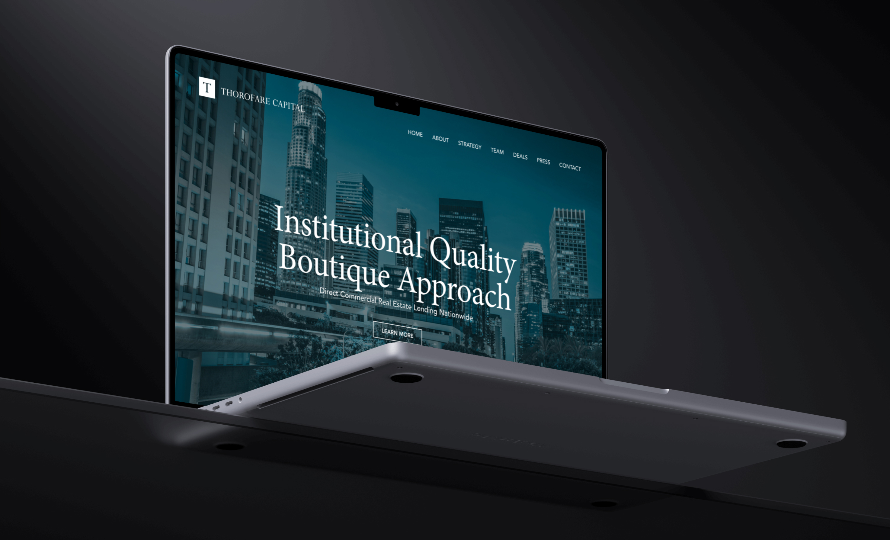 Laptop displaying a modern investment firm website design